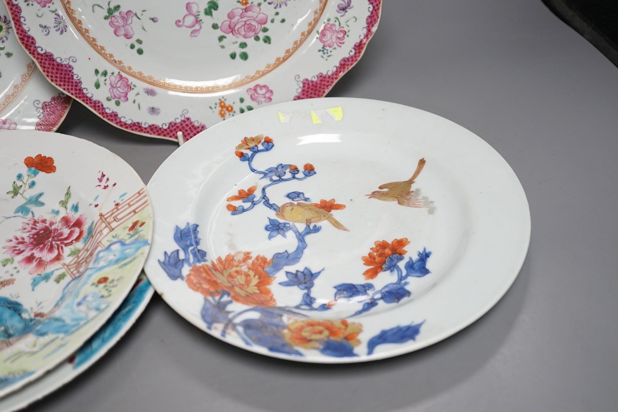 Two pairs of 18th century Chinese famille rose plates and an Imari plate, 26cm